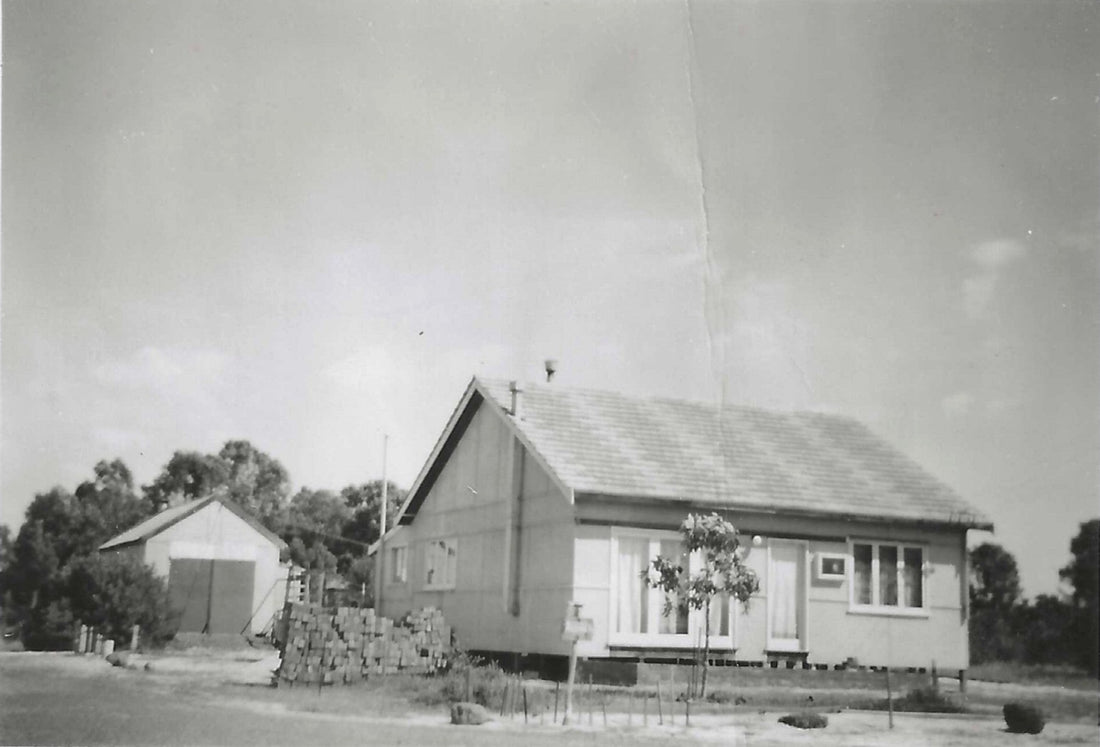 Black-and-white photograph of Michelle’s grandparents’ newly built house and garage in the 1950s.