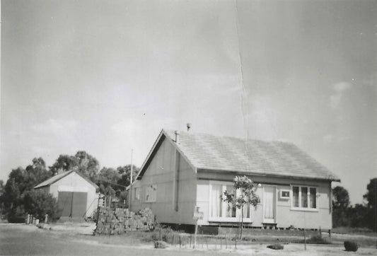 Black-and-white photograph of Michelle’s grandparents’ newly built house and garage in the 1950s.